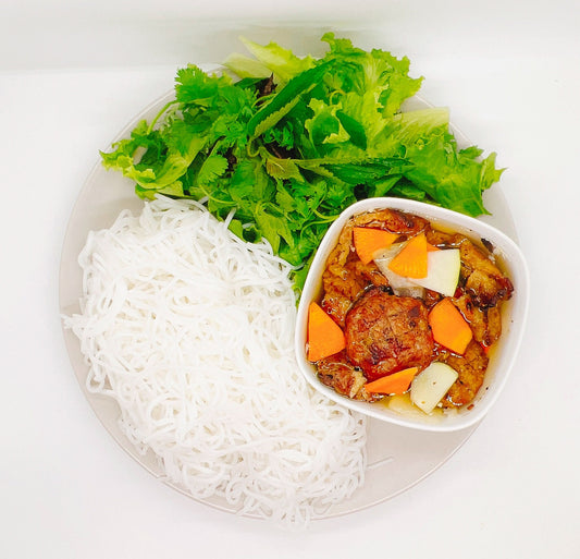 Bun cha Hanoi (Hanoi Grilled Pork Vermicelli) is a traditional Vietnamese dish that is so worth getting to know. A delicious combination of flavorful flame-grilled pork patties, rice noodles and a tangy dipping sauce/broth, you'll immediately love all the flavors and textures.