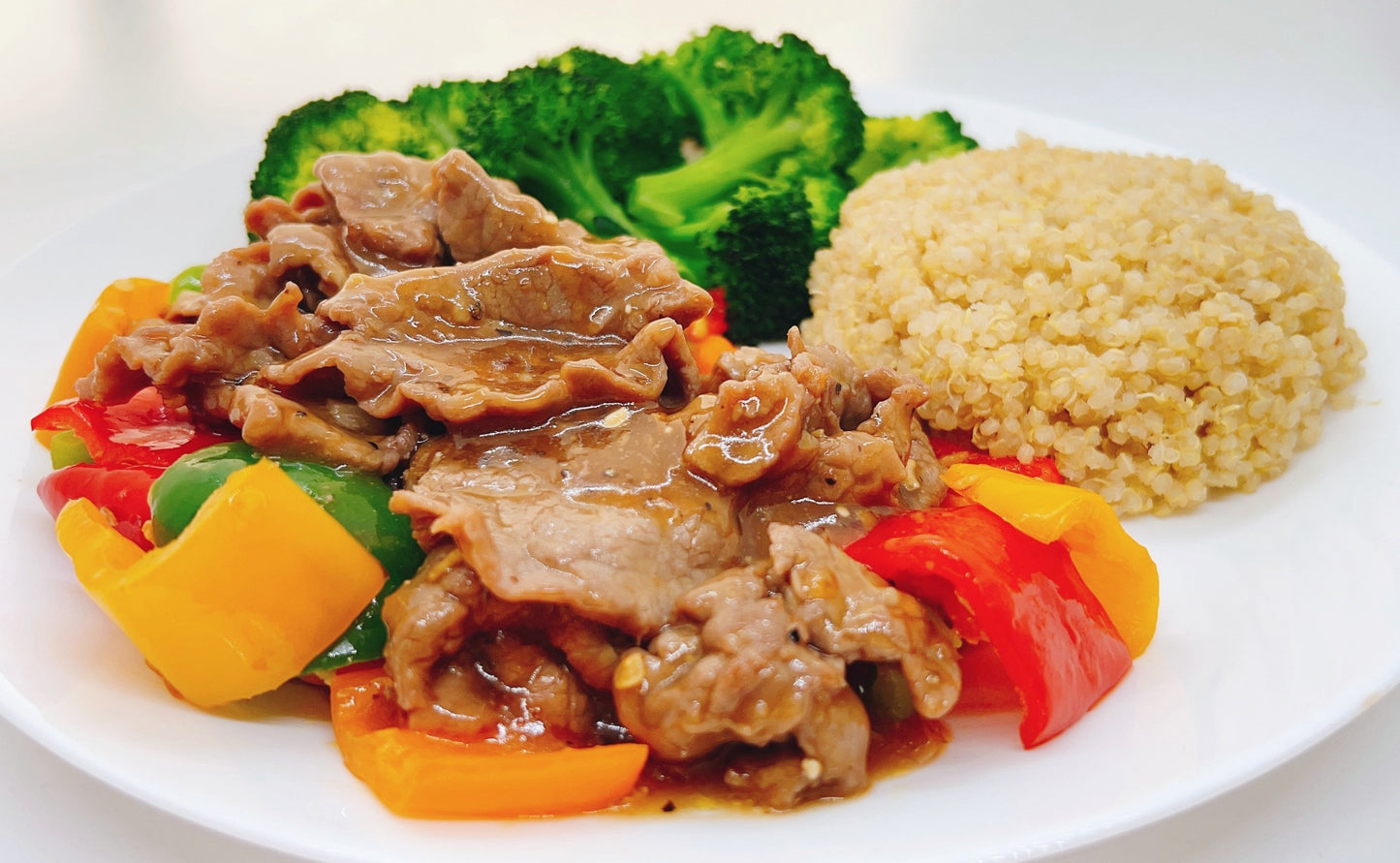 A dish of frying beef coated with T-ZO's special black pepper sauce